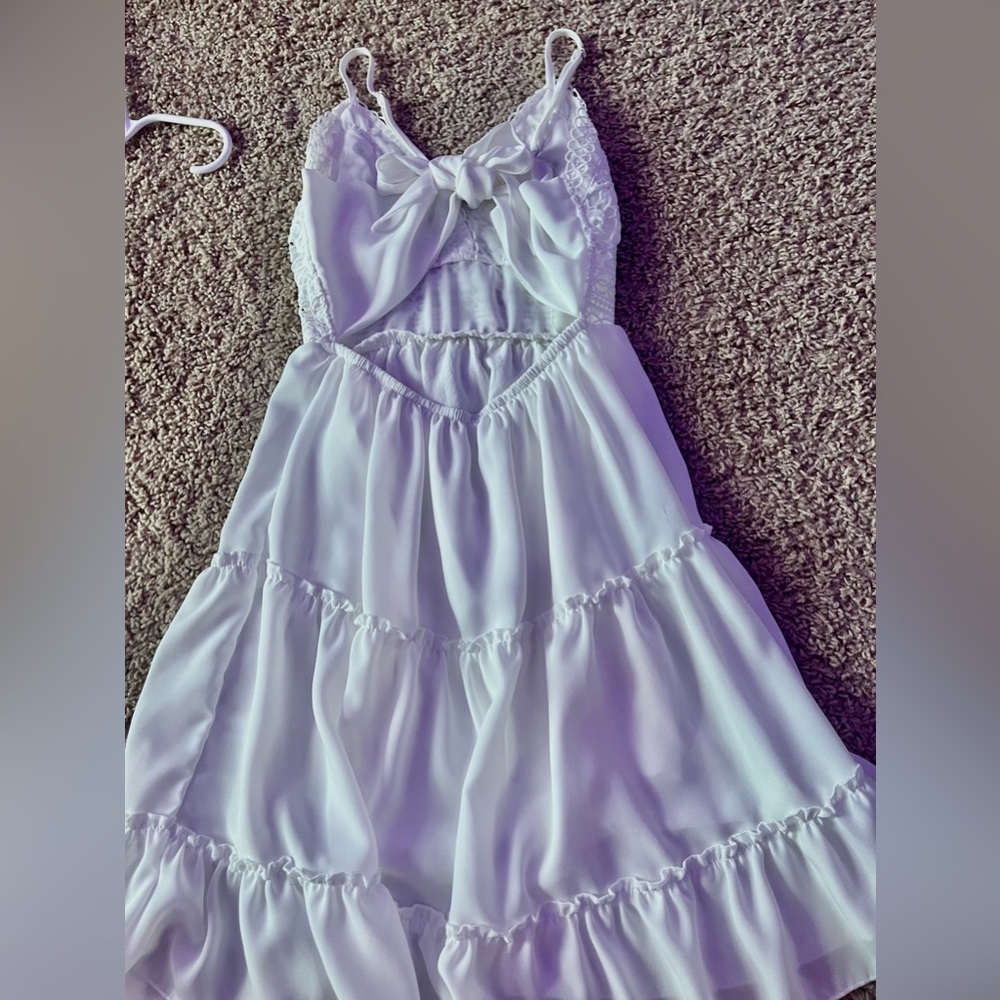 Fits a little different than it looks (longer torso). For a bigger bust.